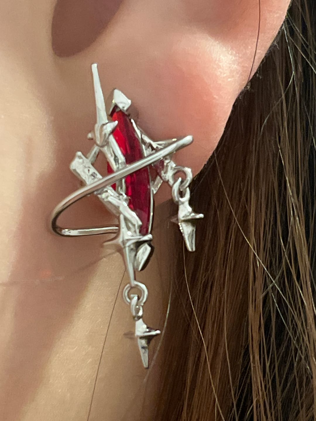 Customer photo review of "Star Trails" Platinum Plated Celestial Star Trails Moissanite Statement Stud Earrings