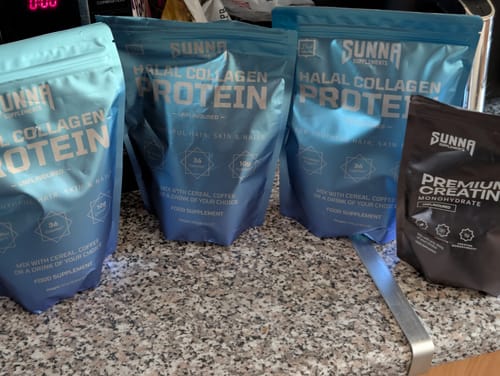 Customer's three blue pouches of Halal Collagen Protein lined up on a kitchen counter.