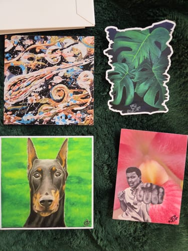Customer displays four custom stickers from the Secret Sticker Sale featuring their colorful artwork on a green background.