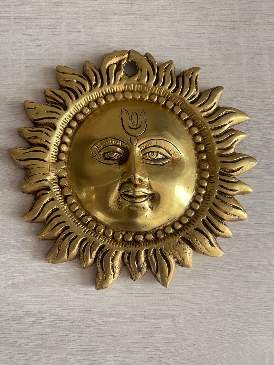 Customer photo review of Brass Vastu Sun Wall Hanging Idol Vastu Remedy for East Direction Balance, Fame and Positive Energy for Home, Office and Entrance Decor | 15 x 15 cm | 800 g