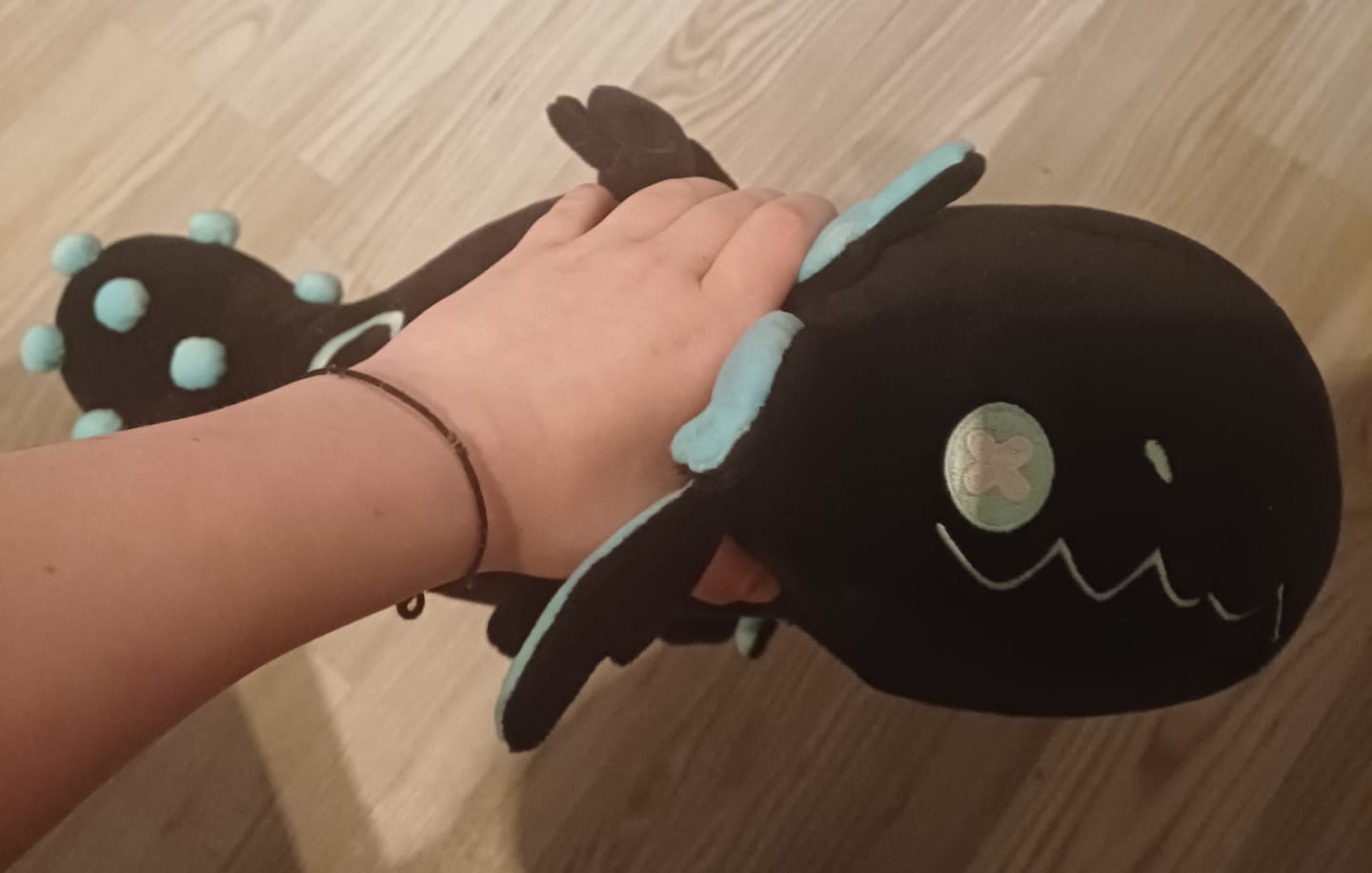 Customer photo review of Rain World - Glowing Cyan Lizard Plush