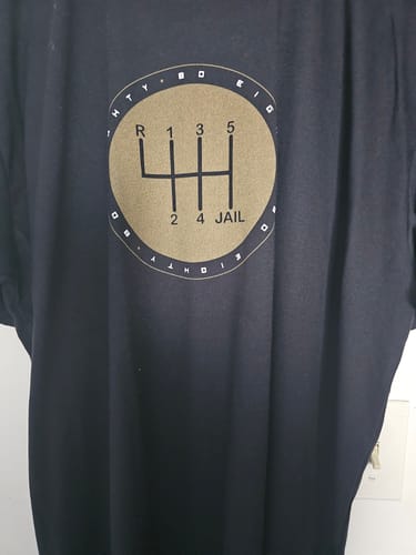 Customer's black 6Speed = Jail Shirt, showing the gold circular gear shift graphic on the chest.