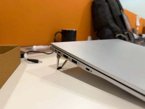 Customer's Casence AirStand for Laptop elevating a silver laptop on a desk for an ergonomic viewing angle.