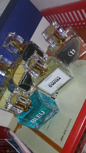 Customer's Summer Box perfumes, including Afternoon Swim, 11 PM, and Bleu De Zing, displayed on the product box.