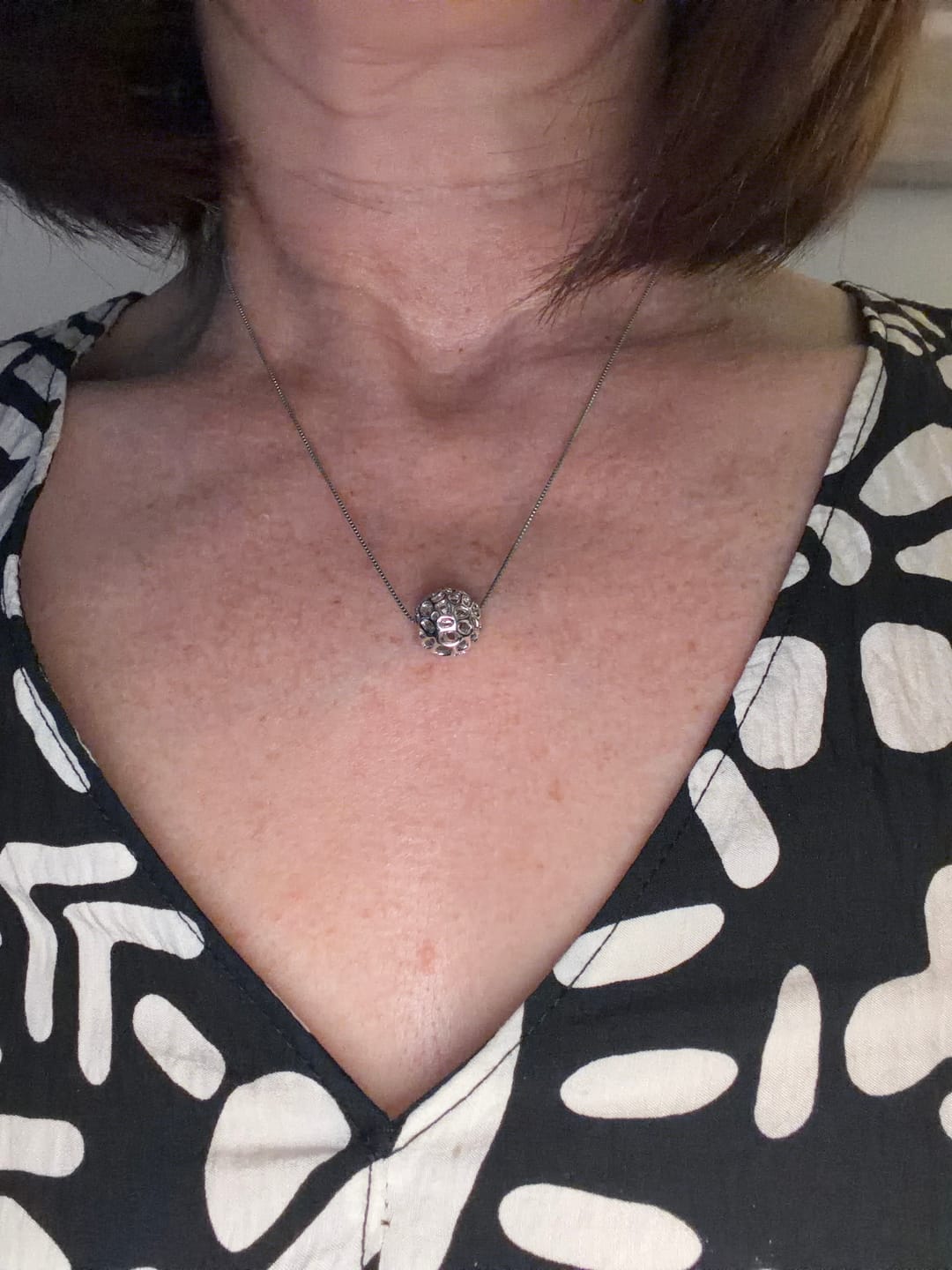 Customer photo review of Lattice Globe Pebble Charm
