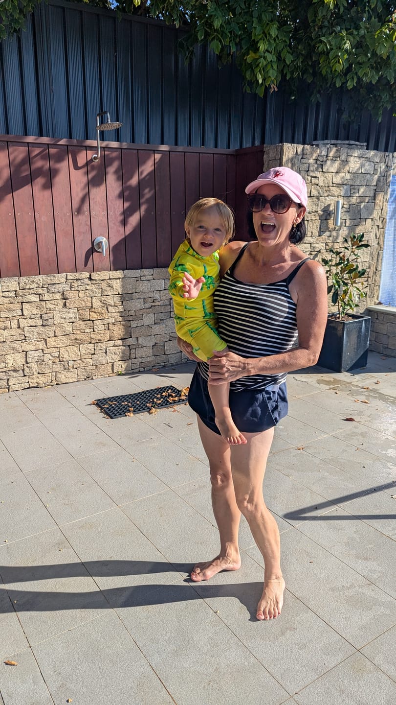 Customer photo review of Fluro Dinosaurs Unisex Long Sleeve Zip Swimmers