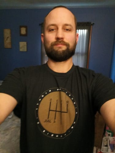 Reviewer wearing the black 80Eighty® 6Speed = Jail Shirt, showing the gear shift graphic on the front.