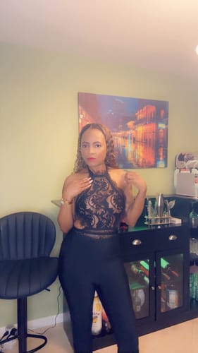 Customer showing the front of the Charmaine Black Lace Jumpsuit with its sheer lace top.