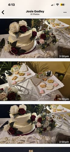 Reviewer's Wedding Deluxe Biscuits displayed on a decorative white cart next to a wedding cake.