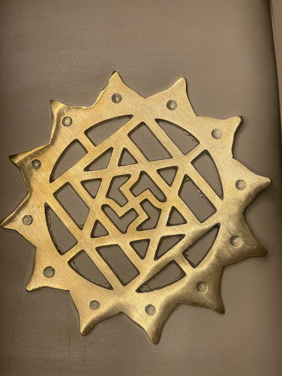 Customer photo review of Brass Swastik with Lotus Helix (Kamal Satya) – Vastu Remedy for Main Door Protection | Evil Eye & Positive Energy Shield | Kitchen/Entrance Placement | 6 x 6 Inch