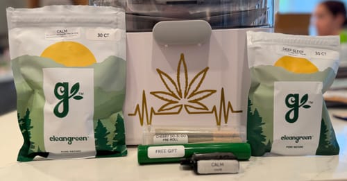 Customer's Relax & Recover Kit with Calm and Deep Sleep gummies, a vape, and flower pre-rolls displayed on a table.