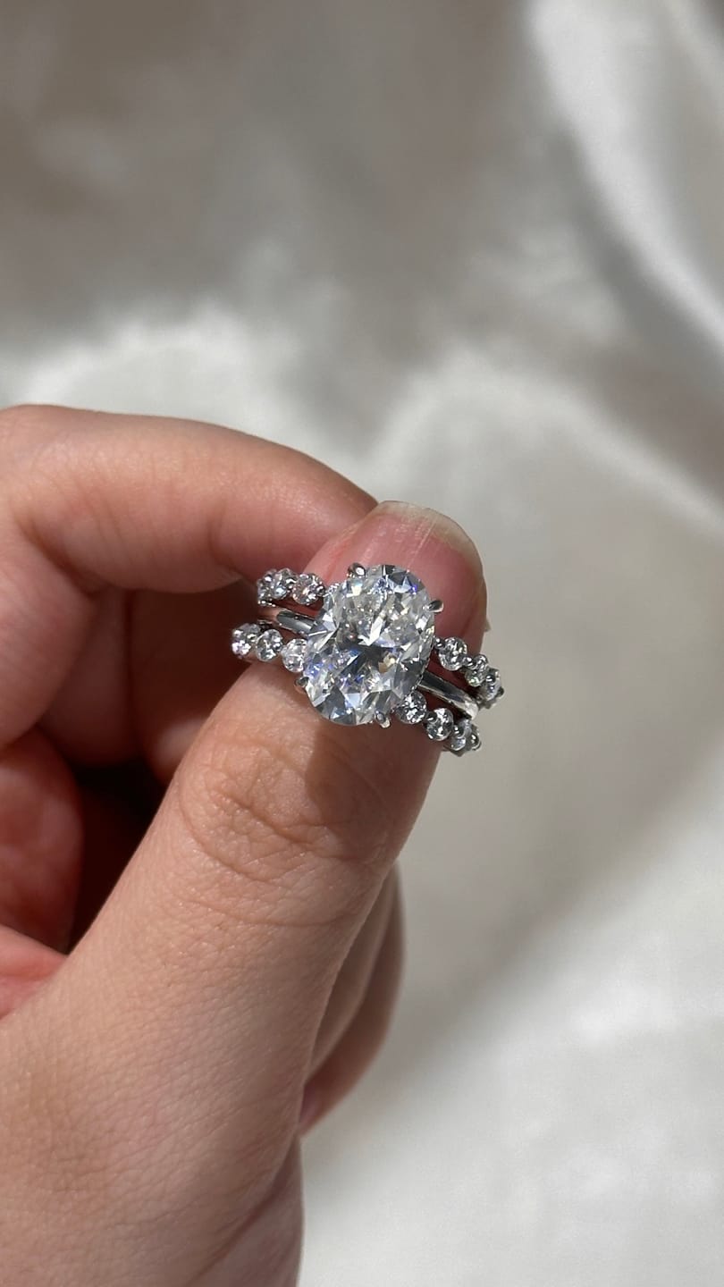 Customer photo review of Moissanite 5.5Ct Hidden Halo Oval Cut Engagement Ring with 1.5 Ct Round Cut White Gold Anniversary Ring