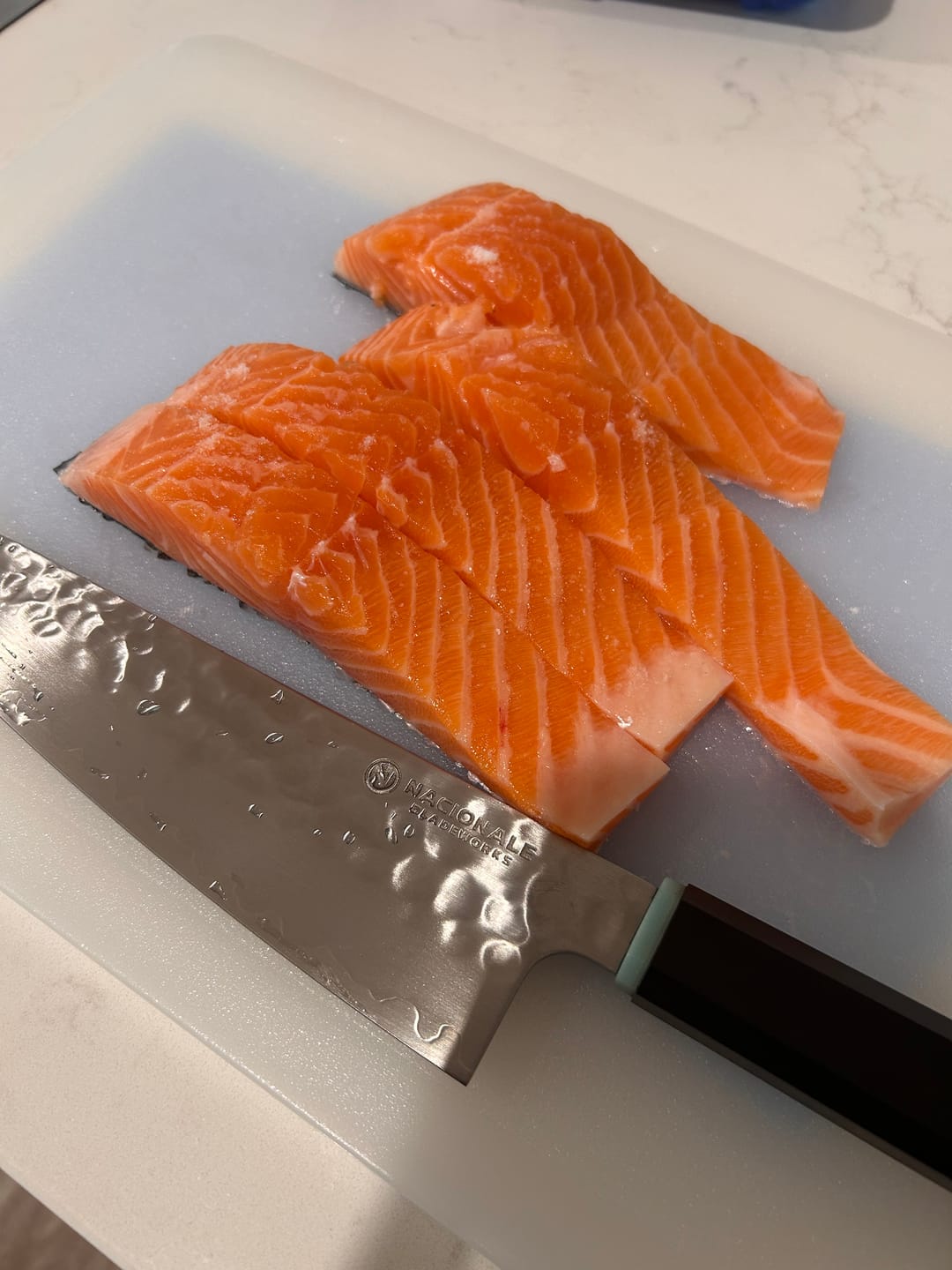 Customer photo review of 215mm Gyuto. Hammered San Mai 440C Stainless. Blue Pakka / Ebony / Oak