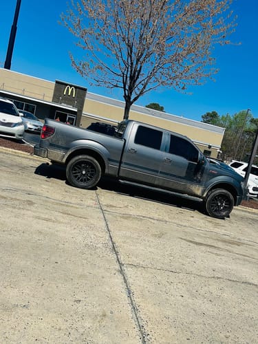 Customer's gray Ford F150 showing its new lifted stance from the 3 inch front leveling lift kit.