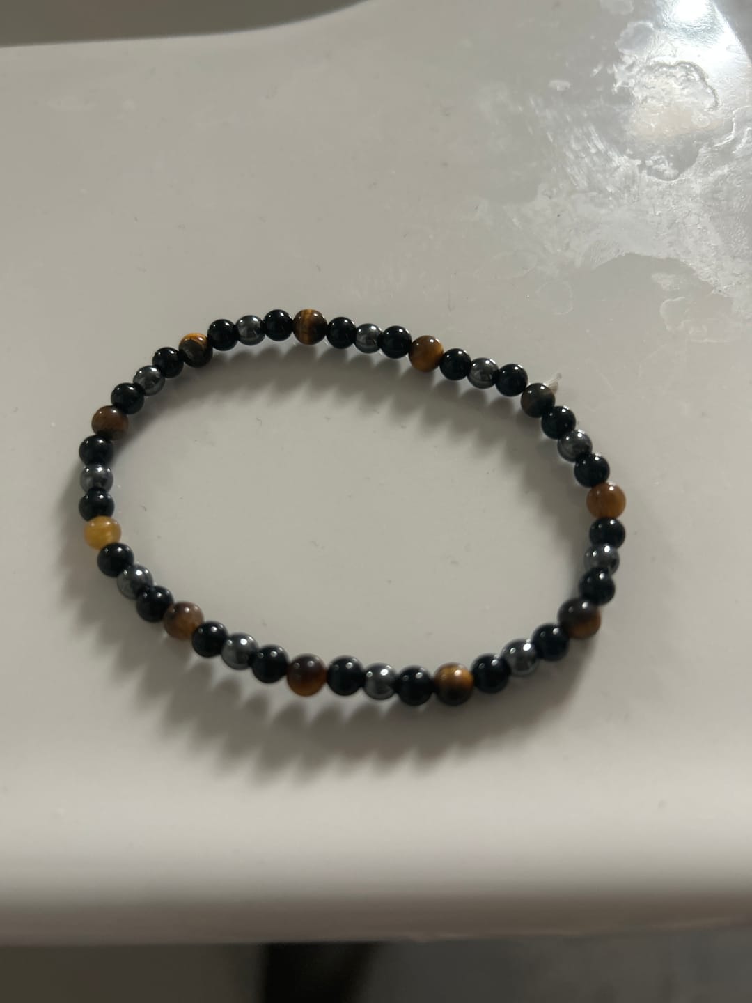 Customer photo review of Bracelet "Triple Protection" en Hématite, Oeil de Tigre et Obsidienne