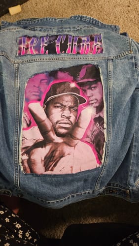 Customer shows a custom denim jacket with patches of rapper Ice Cube made from a music t-shirt.