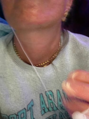 Close-up of a reviewer wearing the gold Chunky Shell Earring.