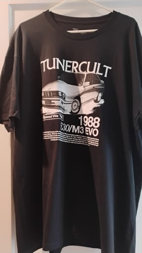 Customer's black t-shirt from the Mystery Cash Box, featuring a white '1988 E30/M3 EVO' Tunercult graphic.