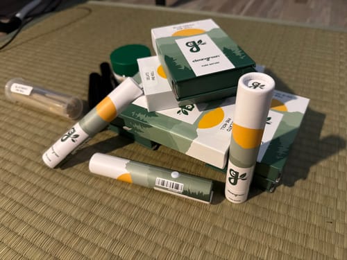Customer's Explorer Pack showing the included pre-roll tubes, boxes, and carry case arranged on a woven surface.