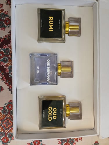 Customer's Khushboo-e-Ramzan bundle showing the Rumi, Oud Nirvana, and Oud Gold perfume bottles arranged in their box.