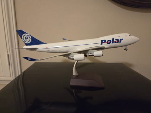 Customer's Polar Air Cargo 747-400F model on its stand, viewed from the side on a black surface.