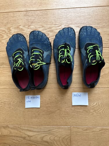 Customer compares a new pair and an 18-month-old pair of blue Fast Ⅰ - Barefoot Shoes from a top-down view.