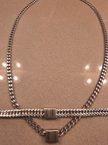 Reviewer's Legacy Set of 2 showing the silver necklace and matching bracelet laid out on a counter.