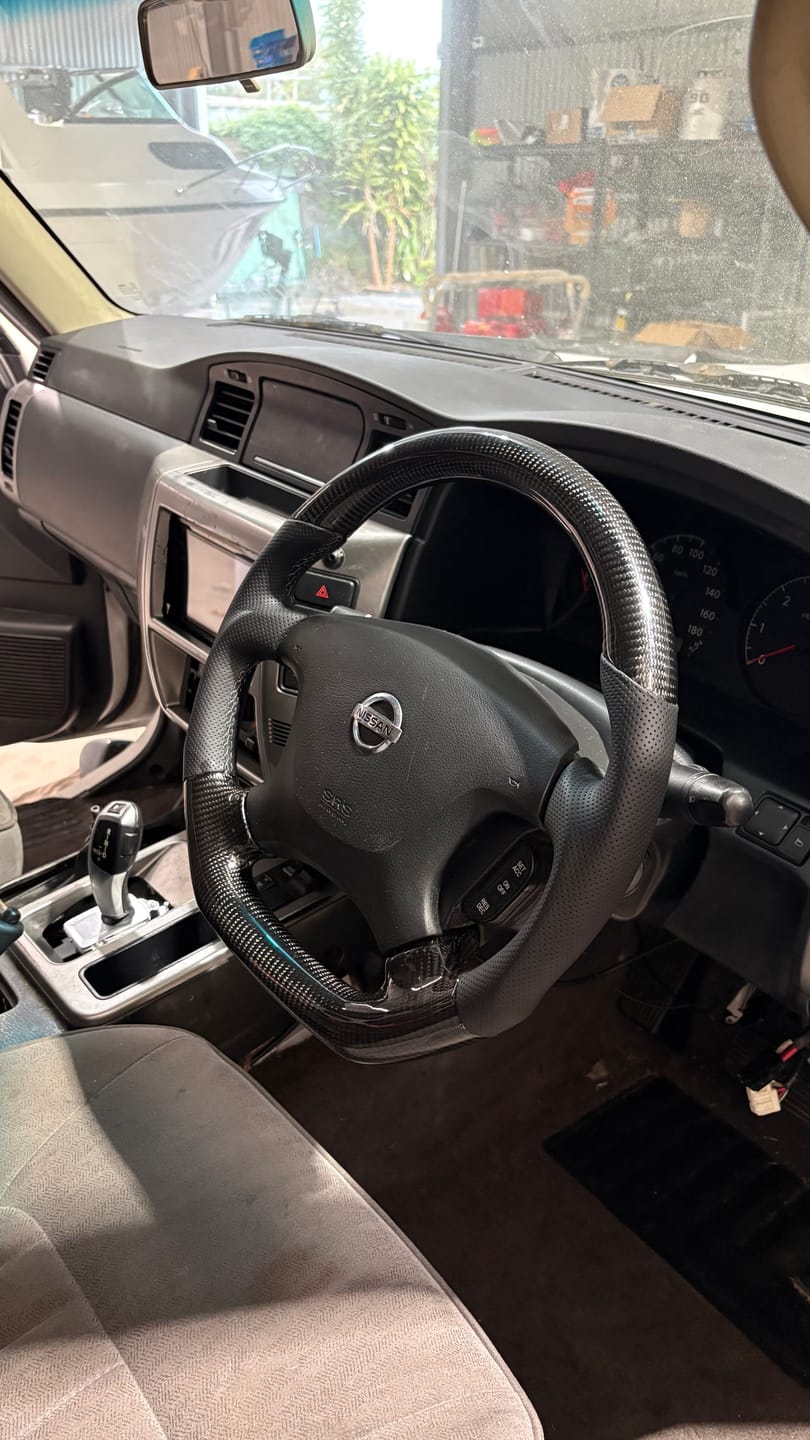 Customer photo review of Nissan Patrol Gu Y61 Premium Steering Wheel - Genuine Perforated Leather & Carbon Fiber *Clearance*