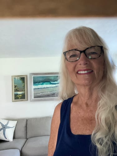 Reviewer smiling, who feels great from taking Collagen Peptides daily.
