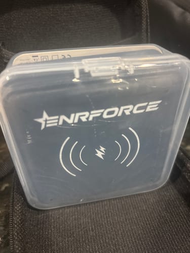 Customer's wireless power bank charger inside its protective semi-transparent case.