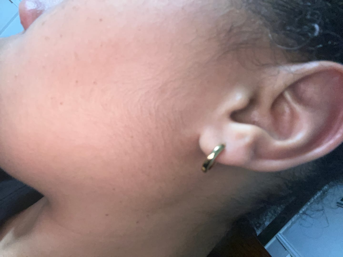 Customer photo review of Minimal Huggie Earrings
