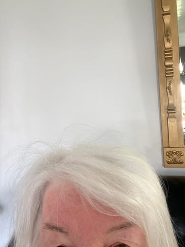 Close-up of a reviewer's white hair after using the Natural Rosemary and Keratin Shampoo.