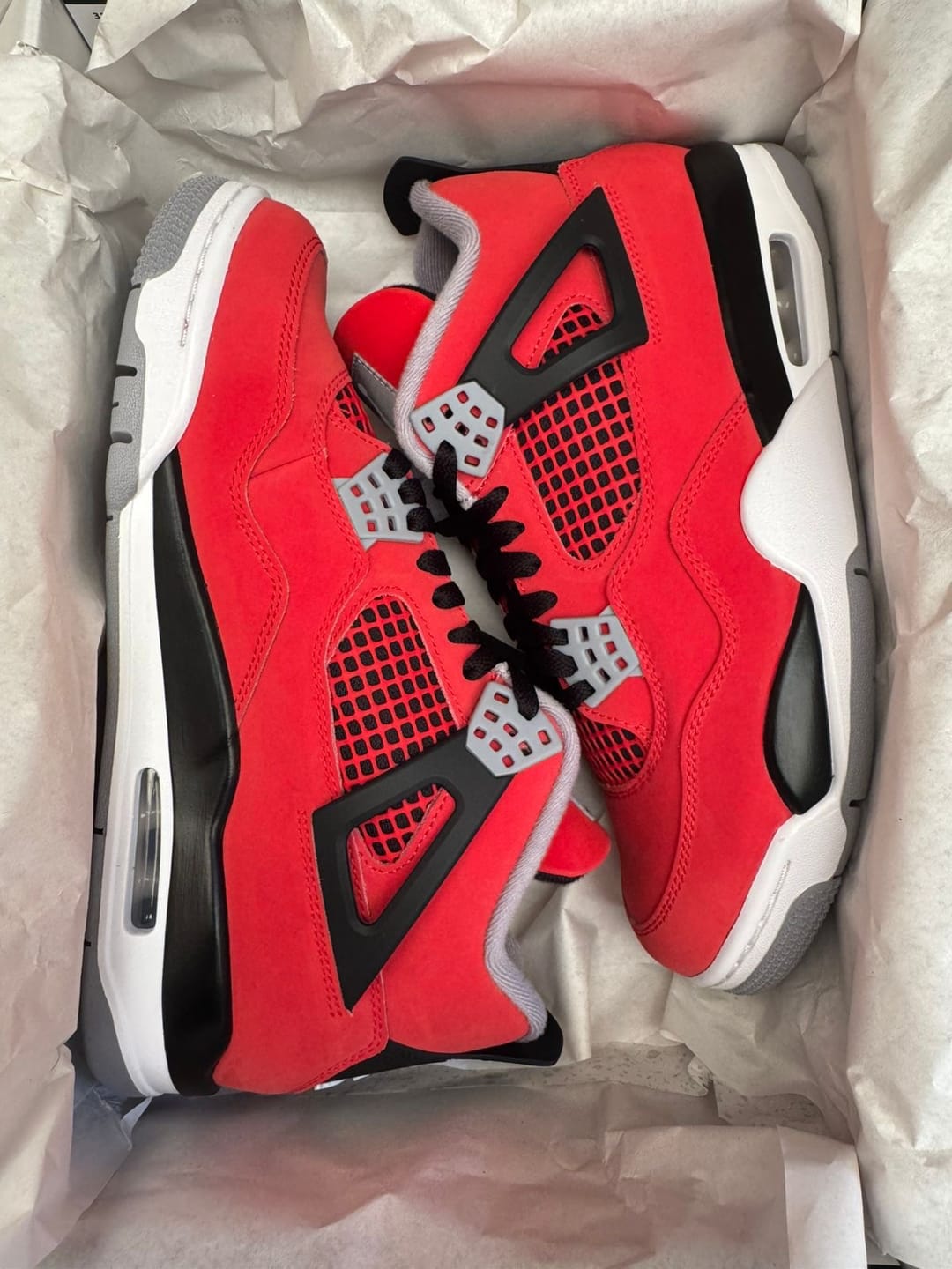 Customer photo review of Air Jordan 4 "Toro Bravo" Fire Red and Black