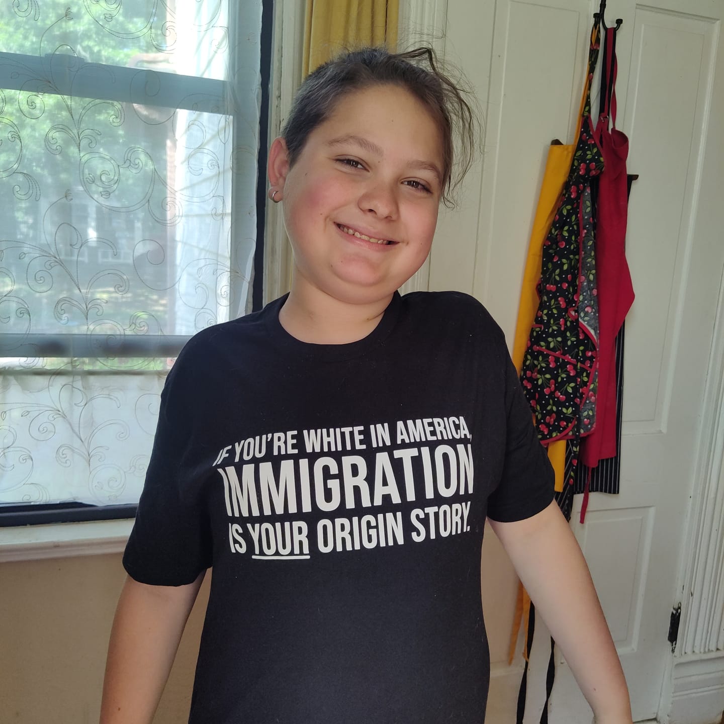 Customer photo review of If you're white in America, IMMIGRATION is your origin story Unisex Tee