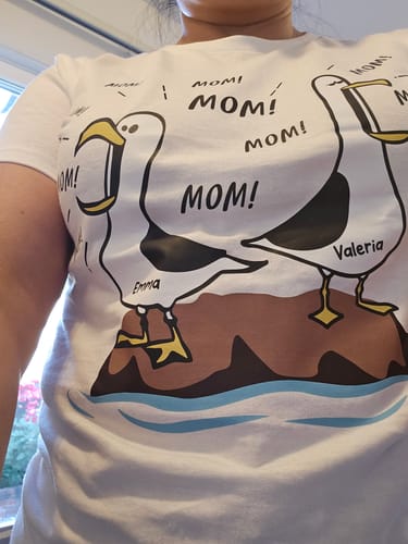 Reviewer wearing their 'Seagull Mom Mom Mom' personalized shirt, showing the clear and funny seagull print.