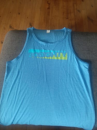 Reviewer's powder blue 80Eighty® Azure Tank laid flat on a sofa.