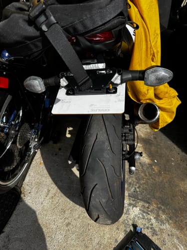 Customer's Universal Adjustable / Flip Bracket installed on a motorcycle, with the license plate flipped up.