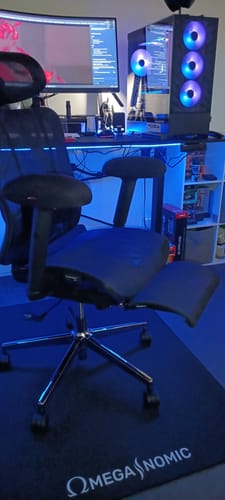 Customer's thick Armrest Pads shown on a gaming chair in a blue-lit room.