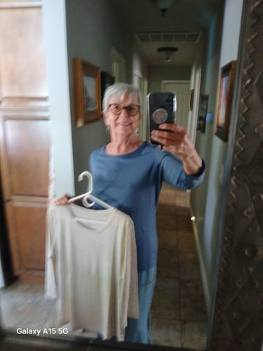 Reviewer in the blue Jenny 3/4 Sleeve Crew Neck, holding a second one in white.