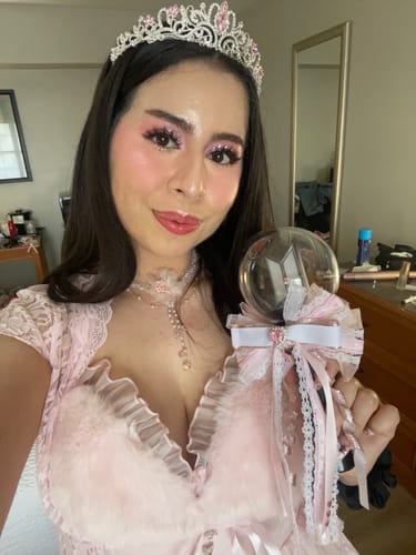 Customer's selfie wearing the pink Bambi Princess dress, showing the fluffy trim on the bust.