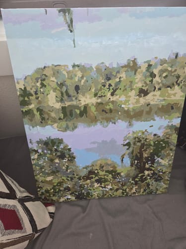 Customer's completed Custom Paint by Numbers Kit showing a vibrant landscape with trees reflected in water.