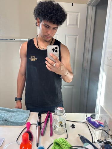 Reviewer wearing the black 80Eighty® Finishline Tank in a mirror selfie.