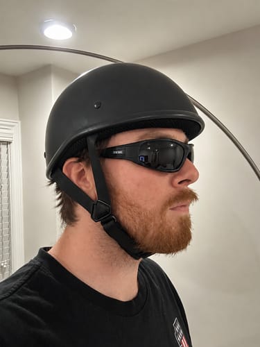 Reviewer's side profile wearing the low-profile, flat black SOA Beanie helmet.