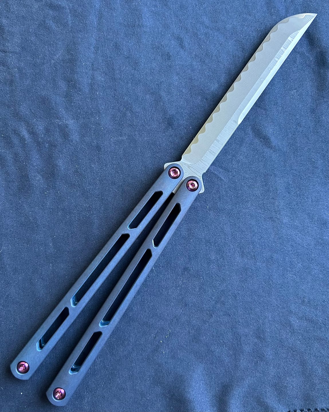 Customer photo review of ARMED SHARK Tsunami Fake Blade Balisong Clone TC4 Titanium alloy handle Damascus stainless steel blade Bushing