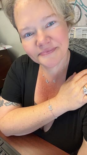 Customer photo review of Butterfly Round Moissanite Pave Sterling Silver Necklace
