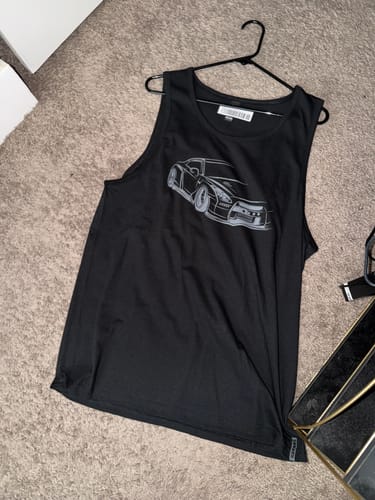 A customer's black 80Eighty® Frontline Tank on a hanger, laid flat to show the sports car graphic.