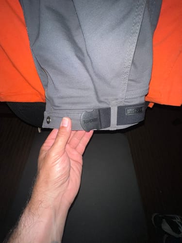 Customer showing the black 80Eighty Resilient Belt with a non-metallic buckle worn on grey pants.