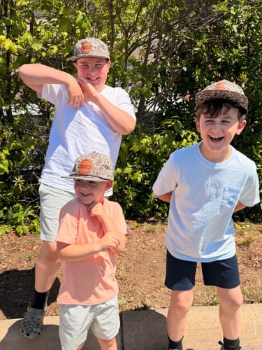 Customer's three boys posing outdoors in matching Custom Leather Patch 5-Panel Rope Hats.