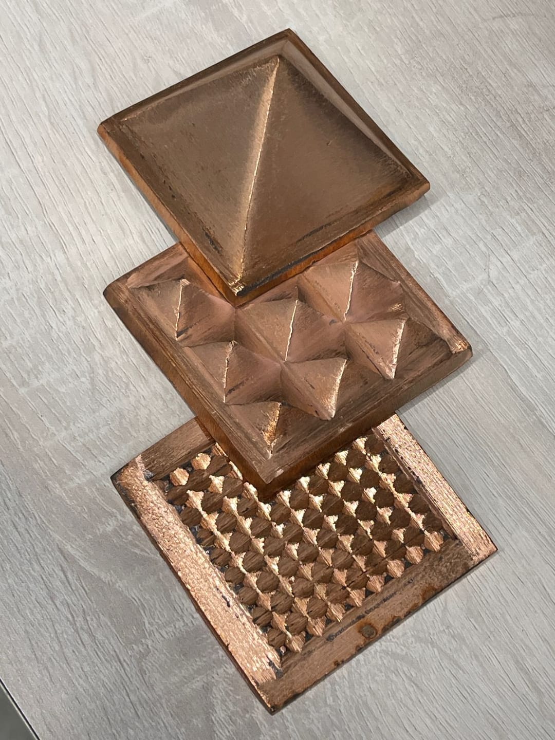 Customer photo review of 3-Layer Copper Pyramid Vastu Remedy for Energy Amplification, Prosperity and South East Direction Activation for Home, Office and Vastu Correction | 5-7.6 cm | 665 g