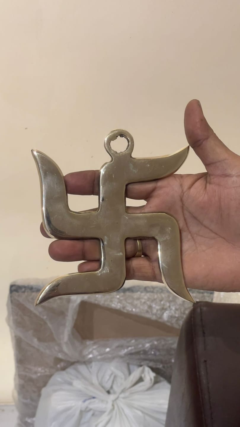 Customer photo review of Brass Swastik – Vastu Remedy for Home Protection | Main Door Dosh Nivaran | 6 & 9 Inch